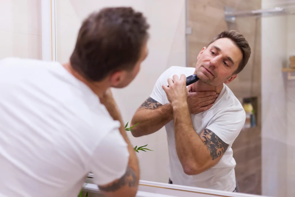 Man maintaining his beard as part of his morning grooming routine
